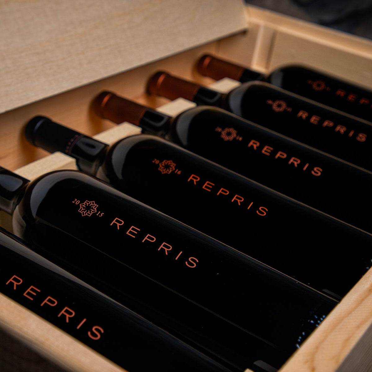 Bottles of REPRIS wine in a wooden case